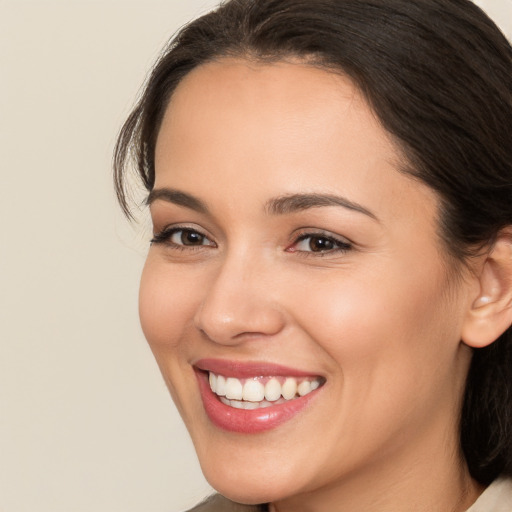 Joyful white young-adult female with medium  brown hair and brown eyes