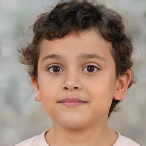 Joyful white child male with short  brown hair and brown eyes