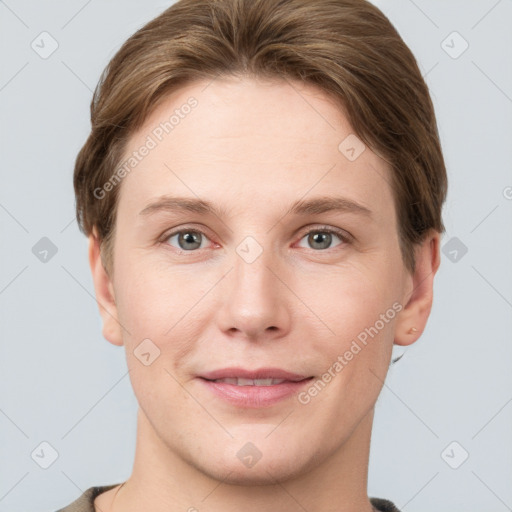 Joyful white young-adult female with short  brown hair and grey eyes