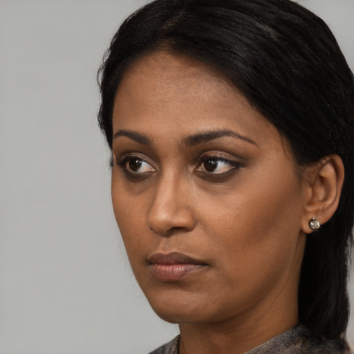 Neutral black young-adult female with short  black hair and brown eyes
