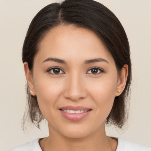 Joyful white young-adult female with medium  brown hair and brown eyes