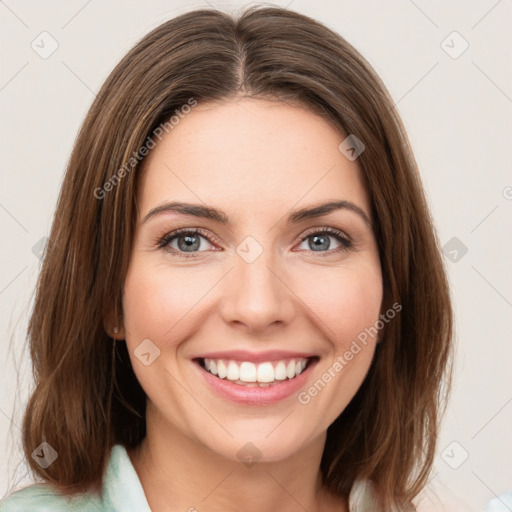 Joyful white young-adult female with medium  brown hair and green eyes