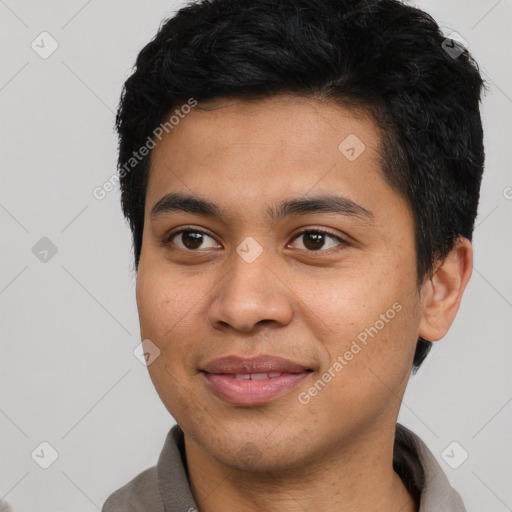 Joyful asian young-adult male with short  brown hair and brown eyes