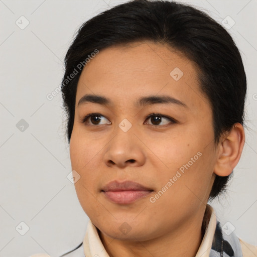 Joyful asian young-adult female with medium  brown hair and brown eyes