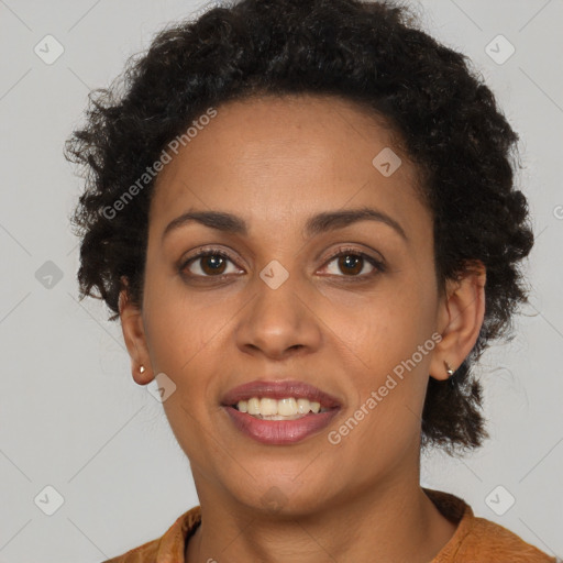 Joyful black young-adult female with short  brown hair and brown eyes