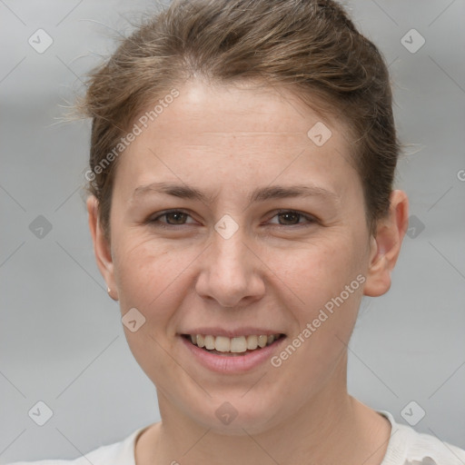 Joyful white young-adult female with short  brown hair and grey eyes