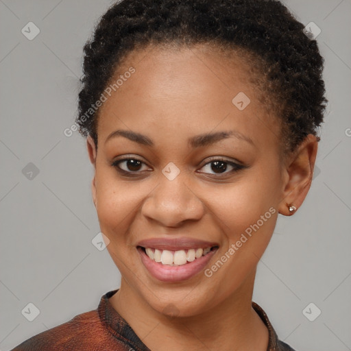 Joyful black young-adult female with short  brown hair and brown eyes