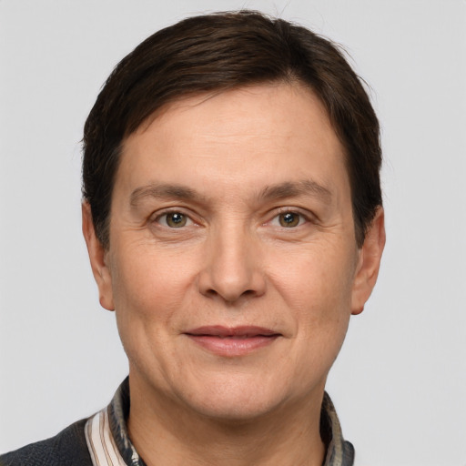 Joyful white adult male with short  brown hair and grey eyes