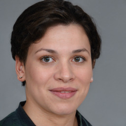 Joyful white young-adult female with short  brown hair and brown eyes