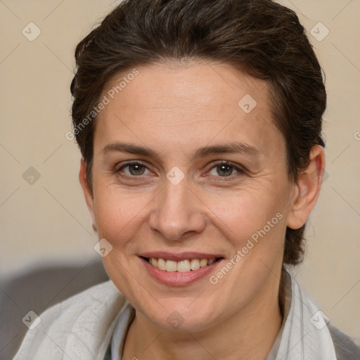 Joyful white adult female with short  brown hair and brown eyes