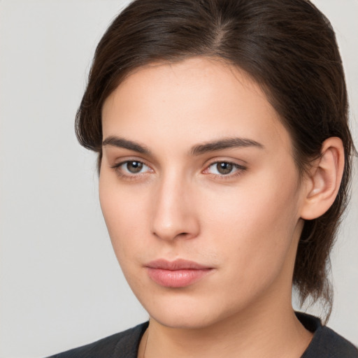 Neutral white young-adult female with medium  brown hair and brown eyes