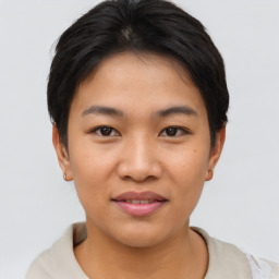 Joyful asian young-adult female with short  brown hair and brown eyes