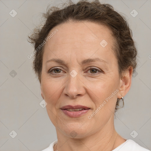 Joyful white adult female with short  brown hair and brown eyes