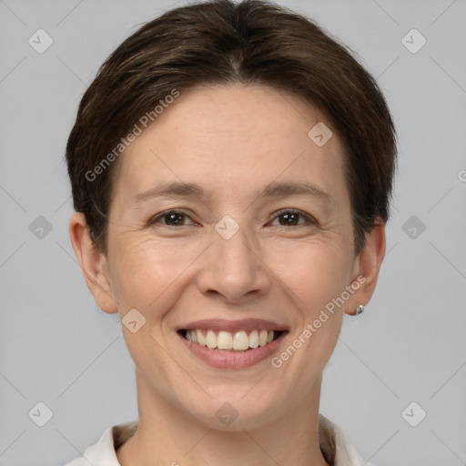 Joyful white adult female with short  brown hair and brown eyes