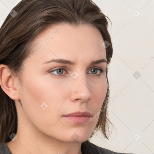 Neutral white young-adult female with long  brown hair and grey eyes