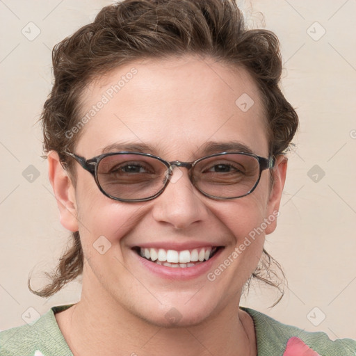 Joyful white adult female with medium  brown hair and blue eyes