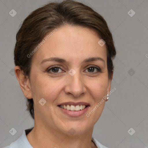 Joyful white adult female with short  brown hair and brown eyes