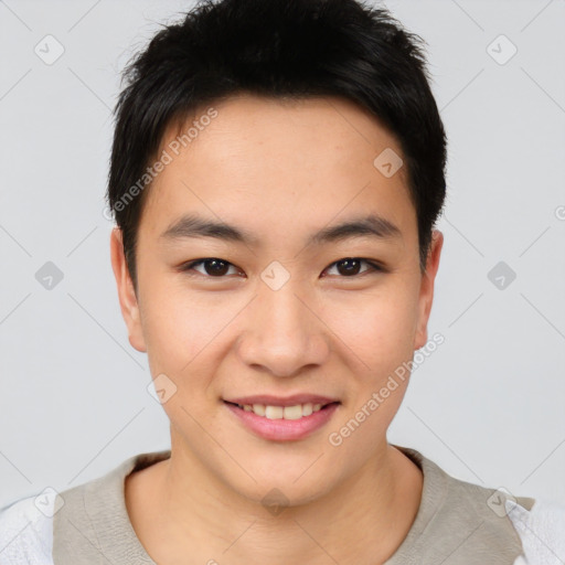 Joyful asian young-adult male with short  brown hair and brown eyes