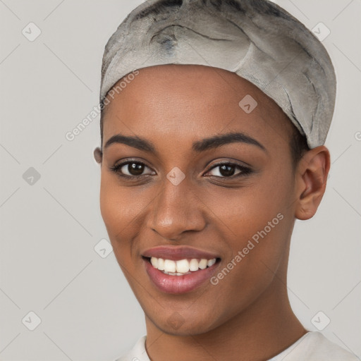 Joyful black young-adult female with short  black hair and brown eyes