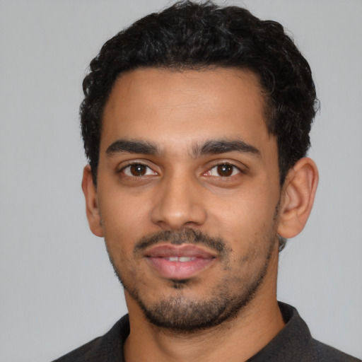 Neutral latino young-adult male with short  black hair and brown eyes
