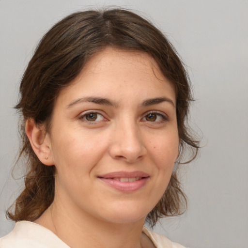 Joyful white young-adult female with medium  brown hair and brown eyes