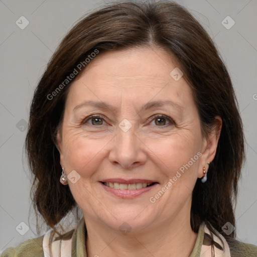 Joyful white adult female with medium  brown hair and brown eyes