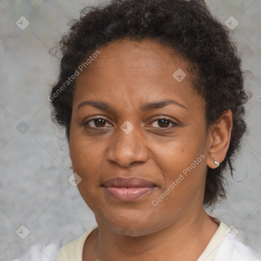 Joyful black adult female with short  brown hair and brown eyes