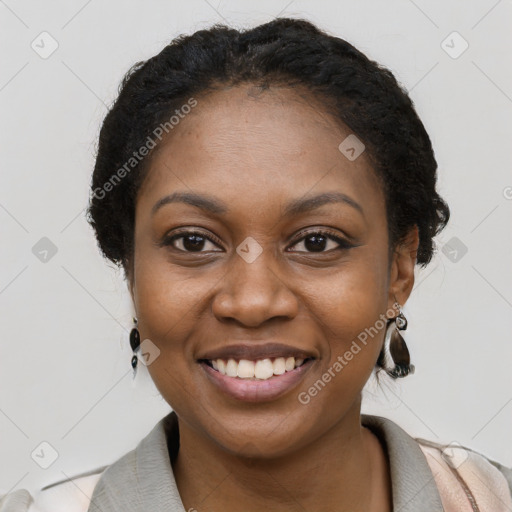 Joyful black young-adult female with long  black hair and brown eyes