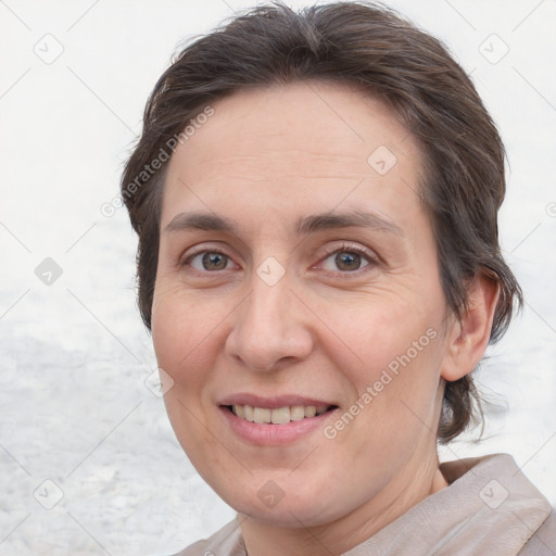 Joyful white adult female with short  brown hair and brown eyes