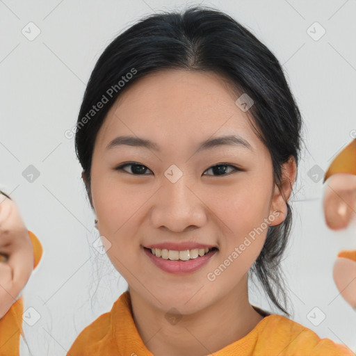 Joyful asian young-adult female with medium  black hair and brown eyes