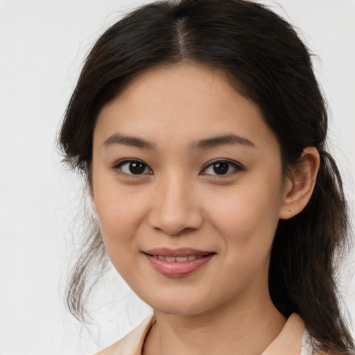 Joyful white young-adult female with medium  brown hair and brown eyes