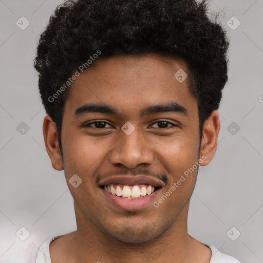 Joyful latino young-adult male with short  brown hair and brown eyes