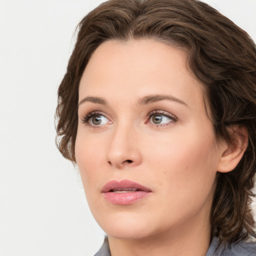 Neutral white young-adult female with medium  brown hair and grey eyes