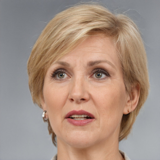 Joyful white adult female with medium  brown hair and grey eyes