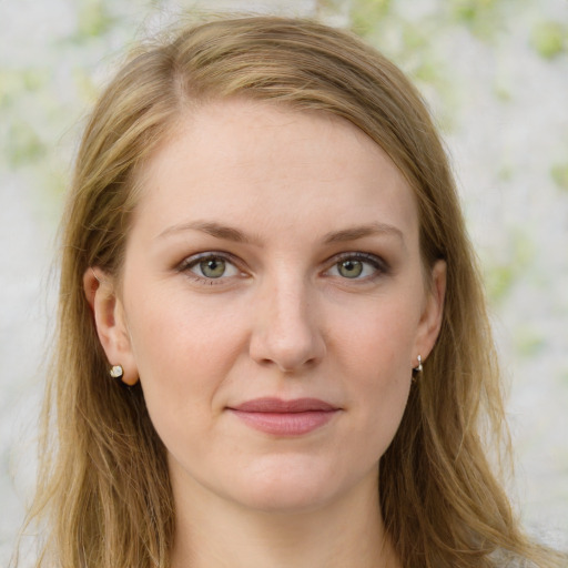 Joyful white young-adult female with long  brown hair and green eyes