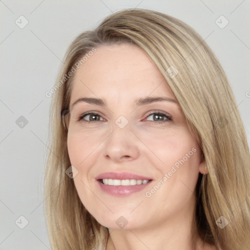 Joyful white adult female with long  brown hair and brown eyes