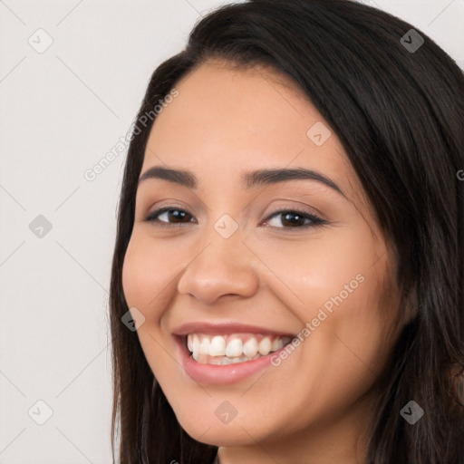 Joyful white young-adult female with long  black hair and brown eyes