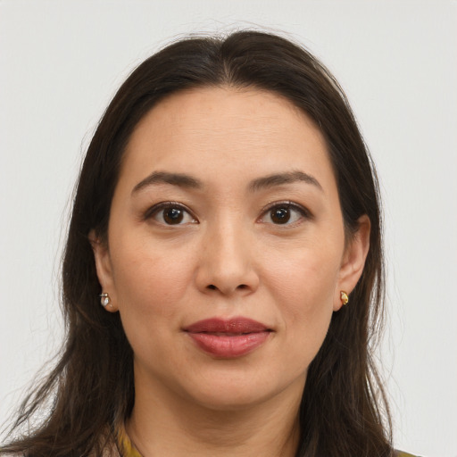 Joyful white young-adult female with long  brown hair and brown eyes