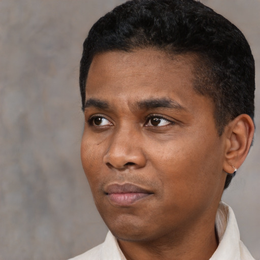 Neutral black young-adult male with short  black hair and brown eyes