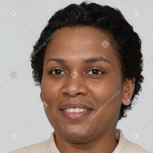 Joyful black adult female with short  brown hair and brown eyes