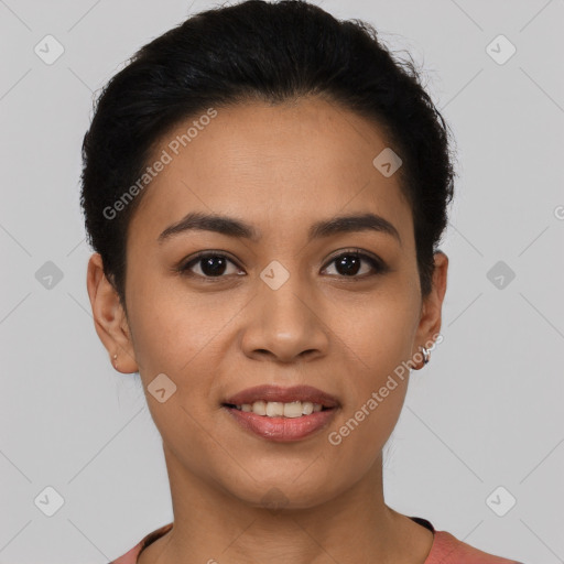 Joyful latino young-adult female with short  brown hair and brown eyes