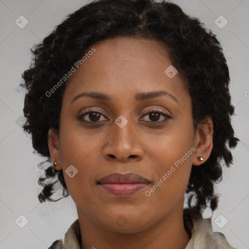 Joyful black young-adult female with medium  brown hair and brown eyes