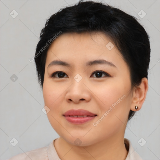 Joyful asian young-adult female with short  black hair and brown eyes