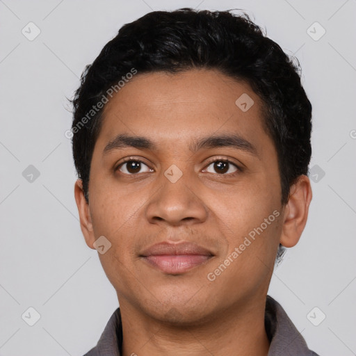 Joyful latino young-adult male with short  black hair and brown eyes