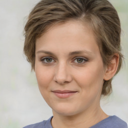 Joyful white young-adult female with medium  brown hair and green eyes