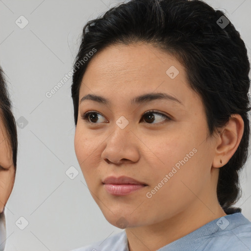 Joyful asian young-adult female with medium  brown hair and brown eyes