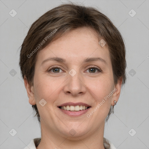 Joyful white adult female with short  brown hair and grey eyes