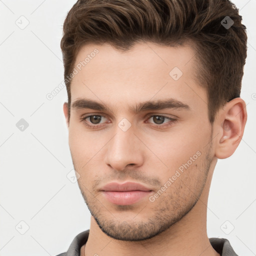 Neutral white young-adult male with short  brown hair and brown eyes