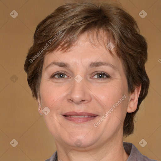 Joyful white adult female with medium  brown hair and grey eyes