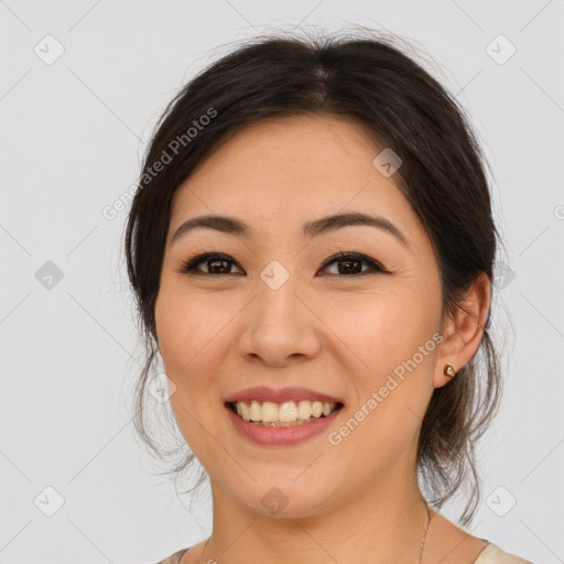 Joyful white young-adult female with medium  brown hair and brown eyes